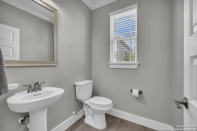 a view of kitchen and hall with wooden floor