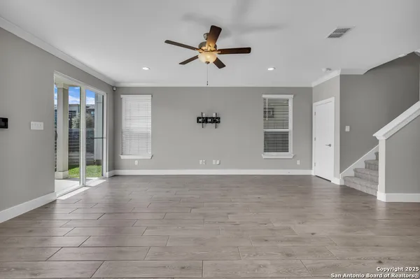 a kitchen with kitchen island a sink stainless steel appliances and cabinets