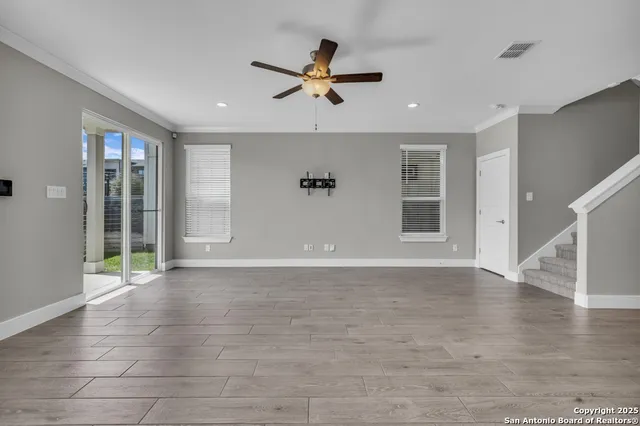 a kitchen with kitchen island a sink stainless steel appliances and cabinets