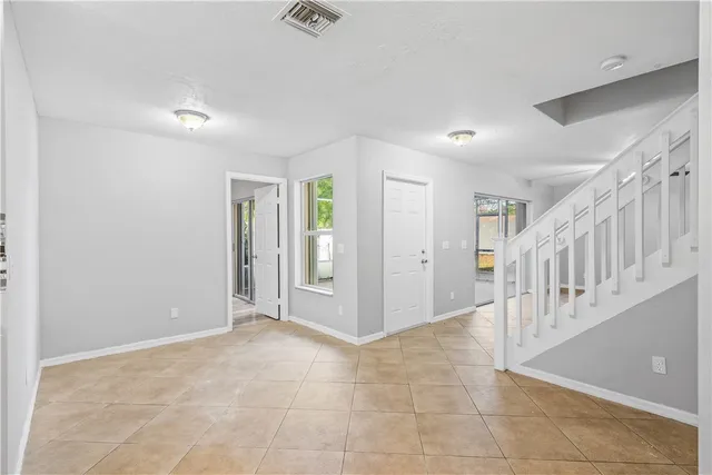 a view of an empty room and wooden floor