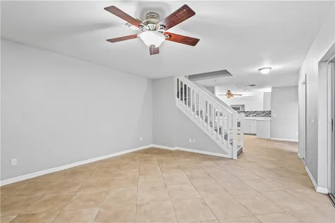 a view of room with window and ceiling fan