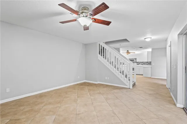 a view of room with window and ceiling fan
