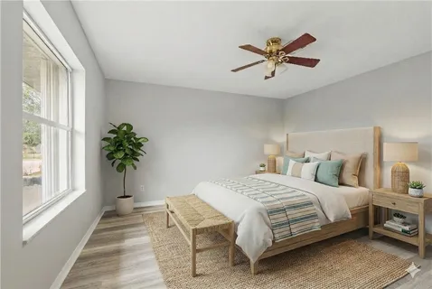 a bathroom with a shower a toilet and a bath tub