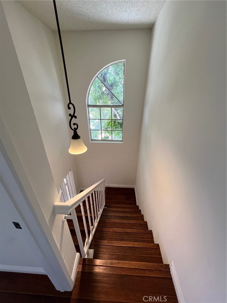 12235 Pine Street, Unit 18 Norwalk, CA 90650 - Photo 6 of 18 a view of entryway and hall with wooden floor