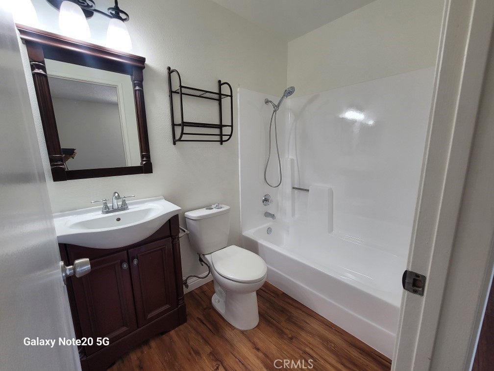 12235 Pine Street, Unit 18 Norwalk, CA 90650 - Photo 10 of 18 a bathroom with a sink toilet and shower