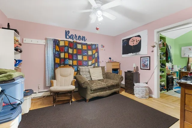 a bed room with furniture and a window