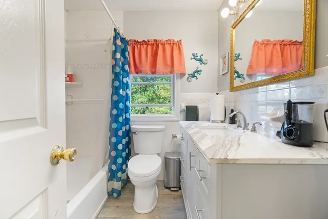 a view of a chairs and table in backyard