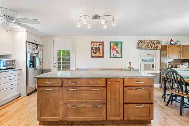 a bed room with furniture and a wooden floor