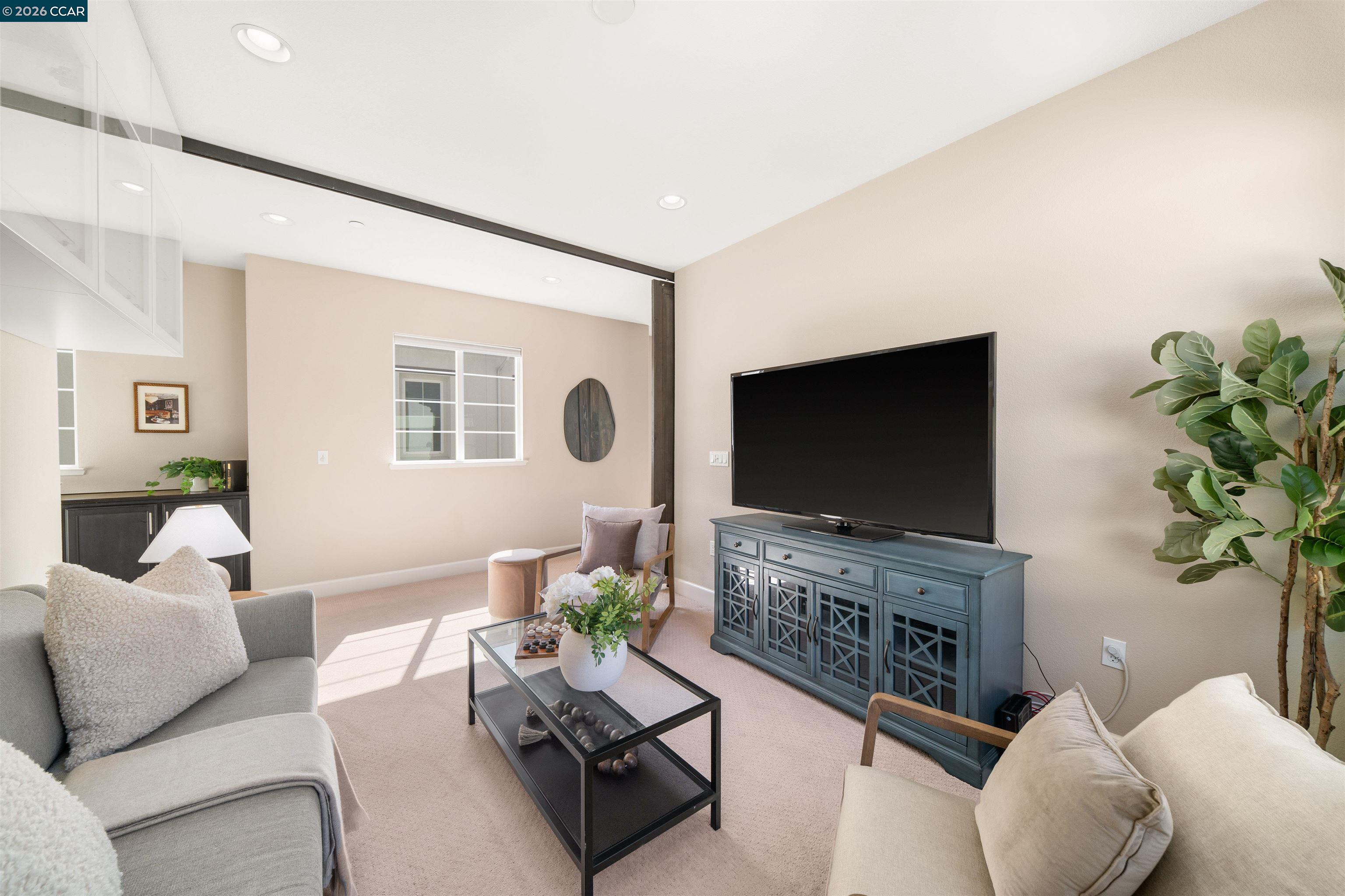2026 Poinsettia Street San Ramon, CA 94582 - Photo 21 of 26 a living room with furniture a flat screen tv and a fireplace