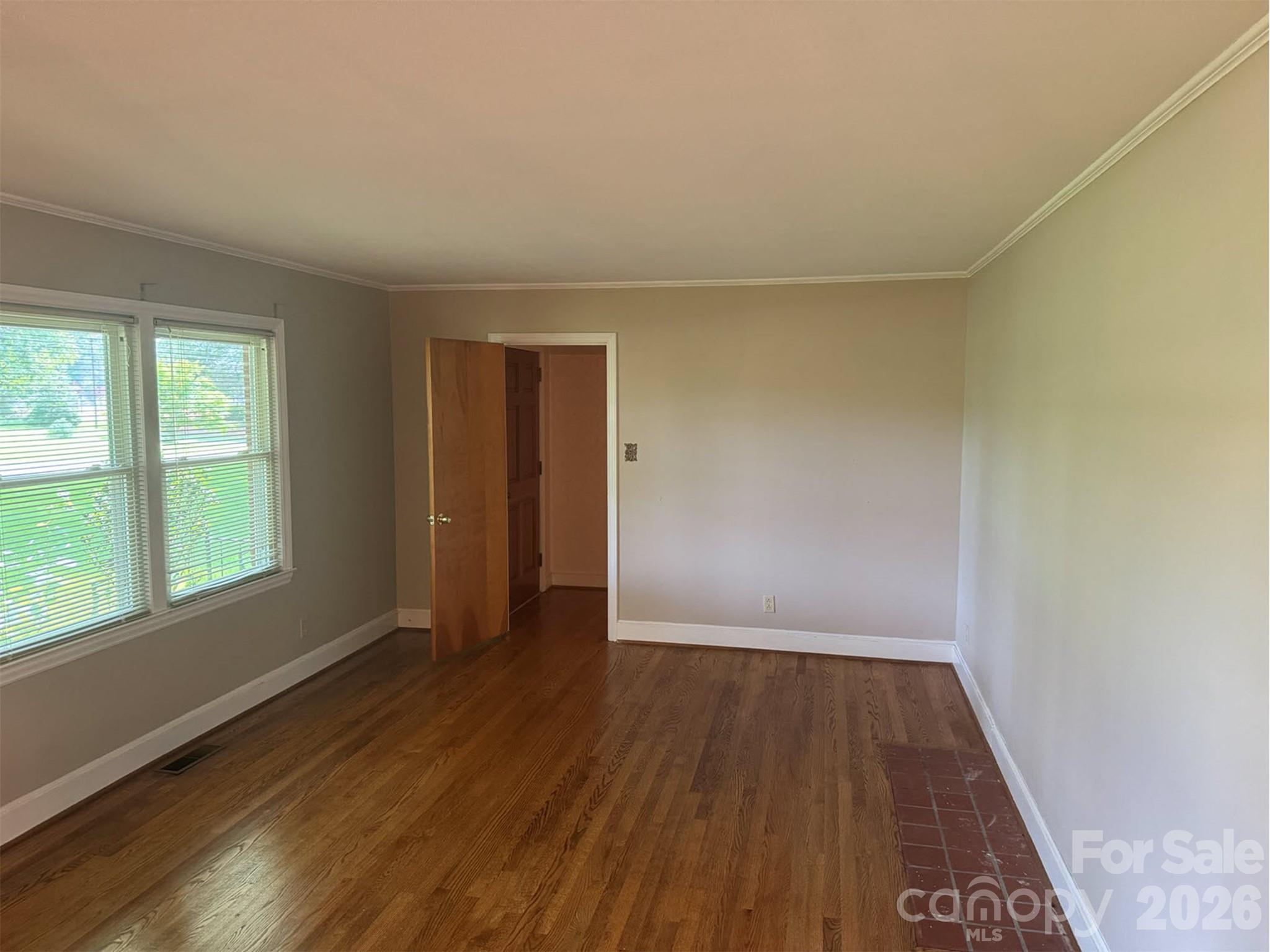 3160 Long Meadow Road Rock Hill, SC 29730 - Photo 6 of 17 an empty room with wooden floor and windows