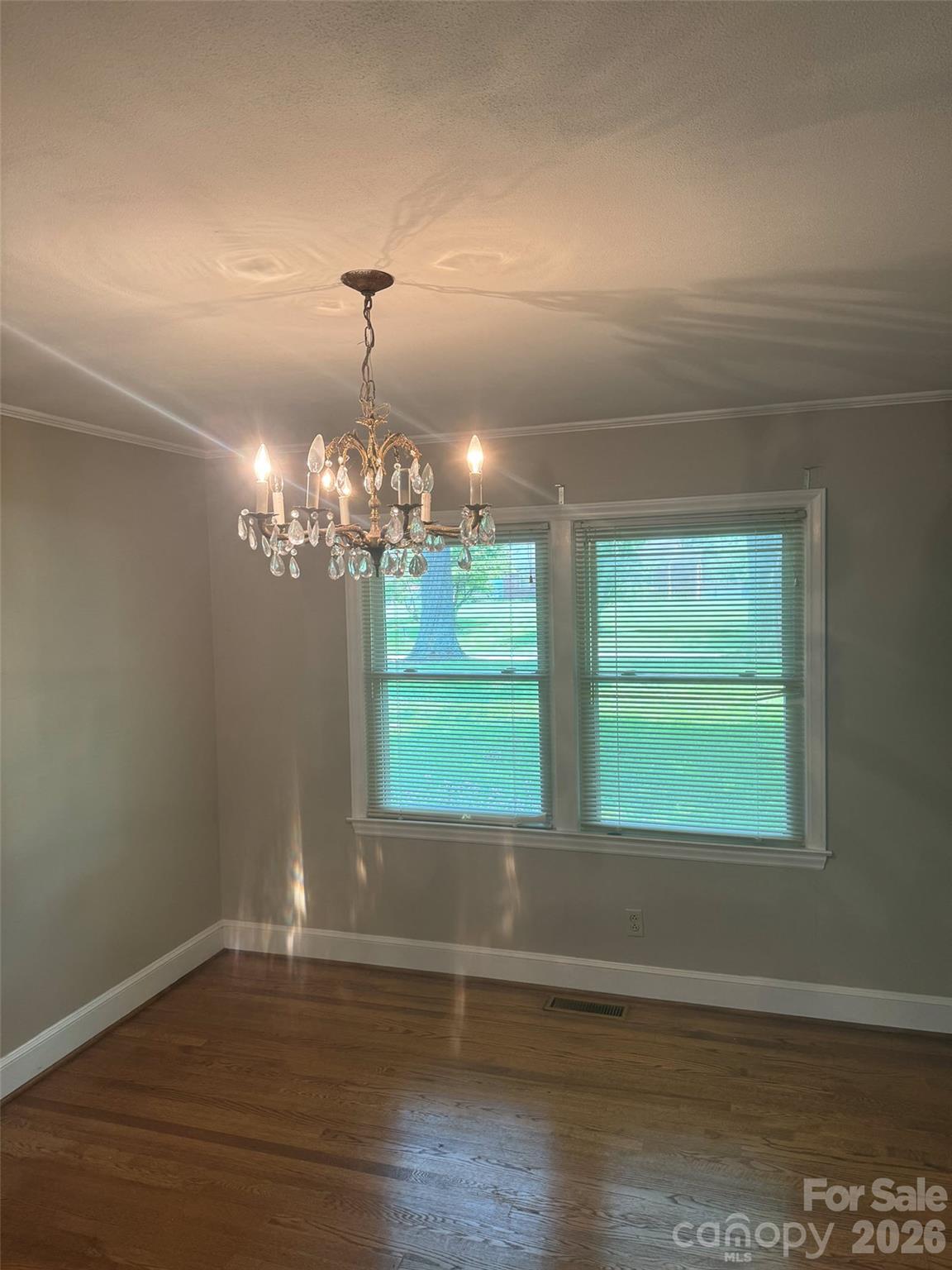 3160 Long Meadow Road Rock Hill, SC 29730 - Photo 7 of 17 a view of a room with wooden floor chandelier and windows