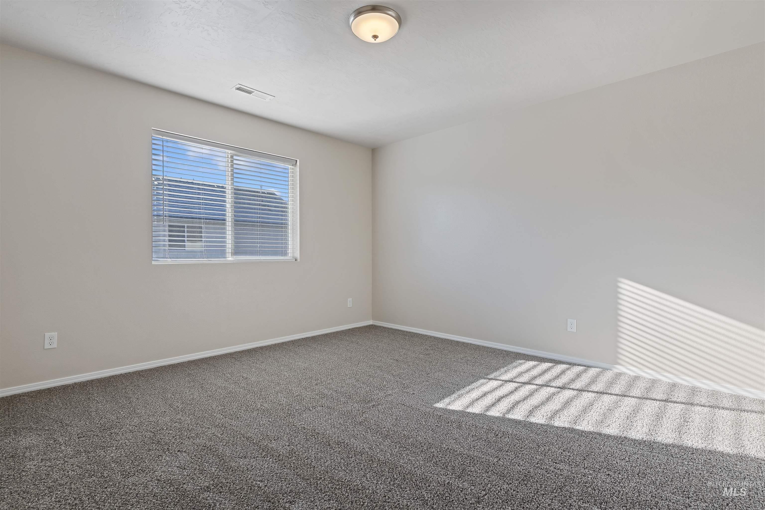 13559 Cocoa Beach Way Caldwell, ID 83607 - Photo 17 of 28 Spare room with carpet and baseboards
