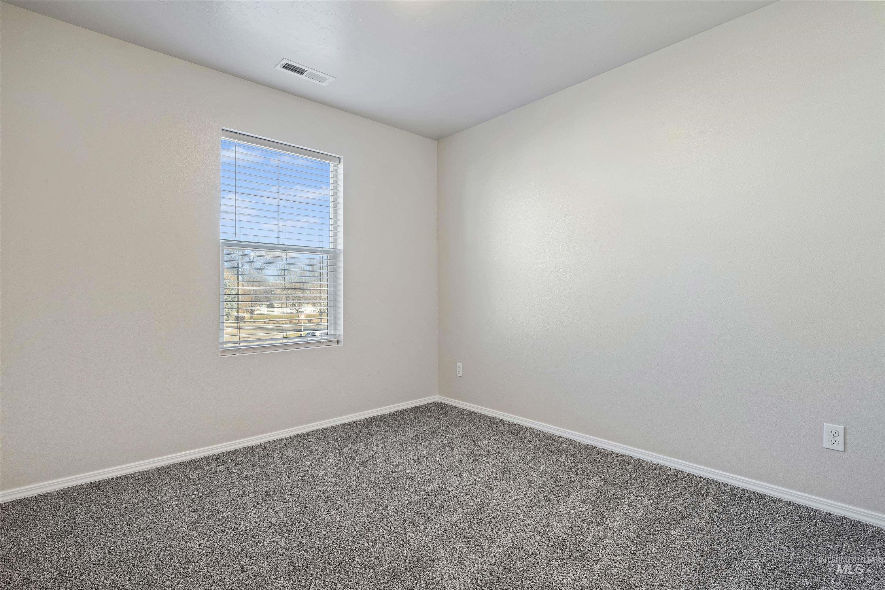 13559 Cocoa Beach Way Caldwell, ID 83607 - Photo 21 of 28 Carpeted empty room featuring baseboards