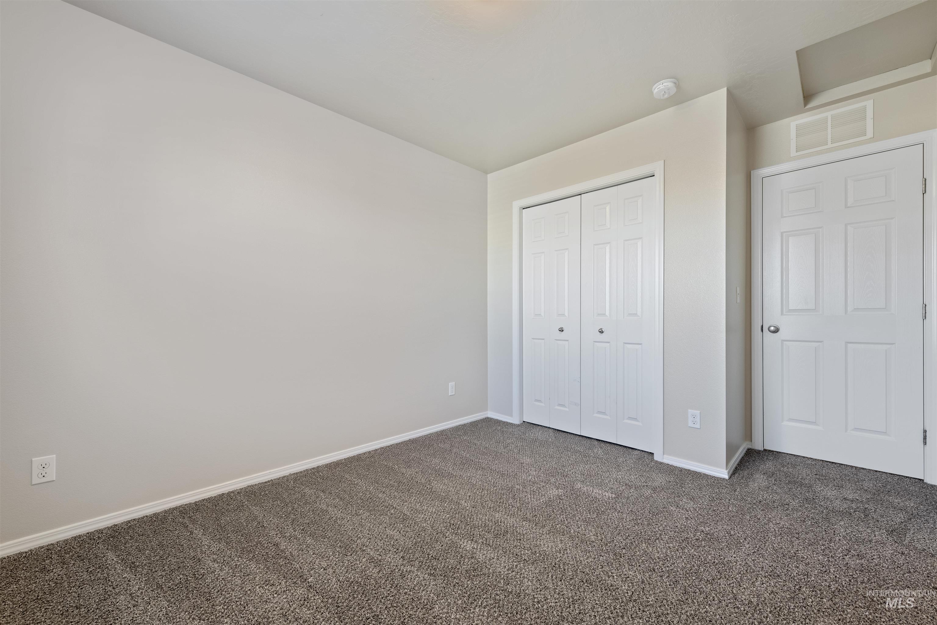 13559 Cocoa Beach Way Caldwell, ID 83607 - Photo 22 of 28 Unfurnished bedroom featuring carpet floors and a closet