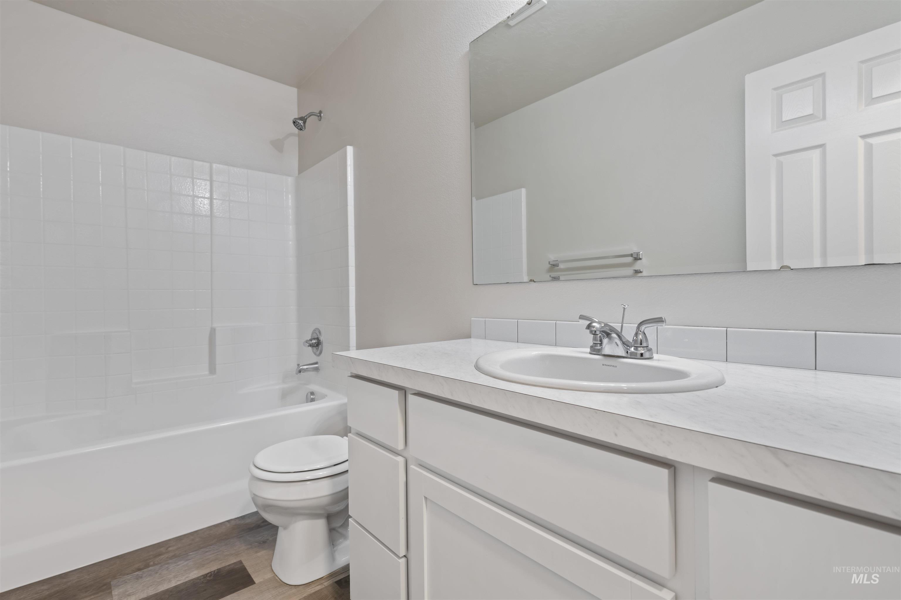 13559 Cocoa Beach Way Caldwell, ID 83607 - Photo 23 of 28 Bathroom with shower / bath combination, vanity, and dark wood-style floors