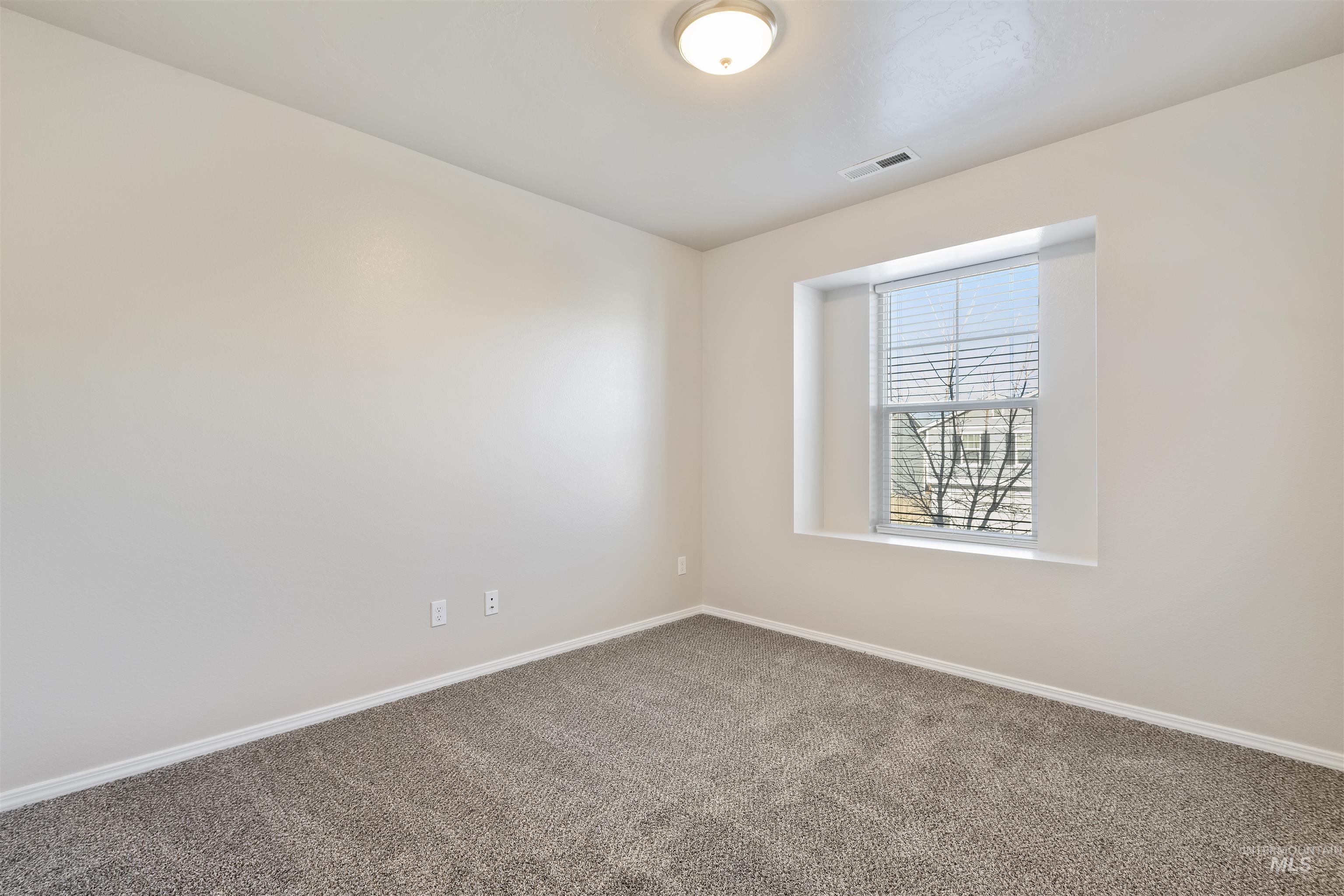13559 Cocoa Beach Way Caldwell, ID 83607 - Photo 24 of 28 Carpeted spare room featuring baseboards