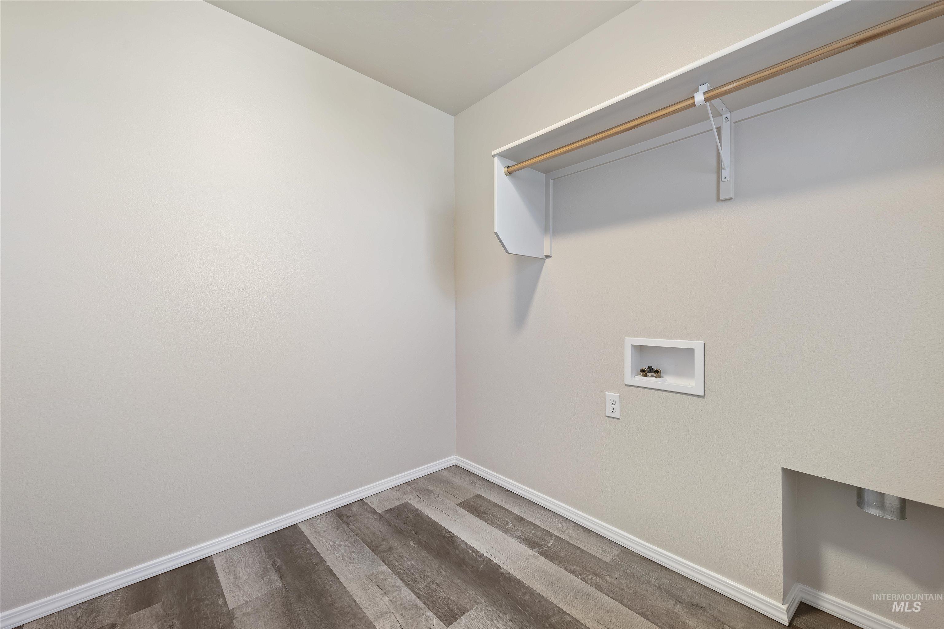 13559 Cocoa Beach Way Caldwell, ID 83607 - Photo 26 of 28 Laundry area featuring wood finished floors and hookup for a washing machine
