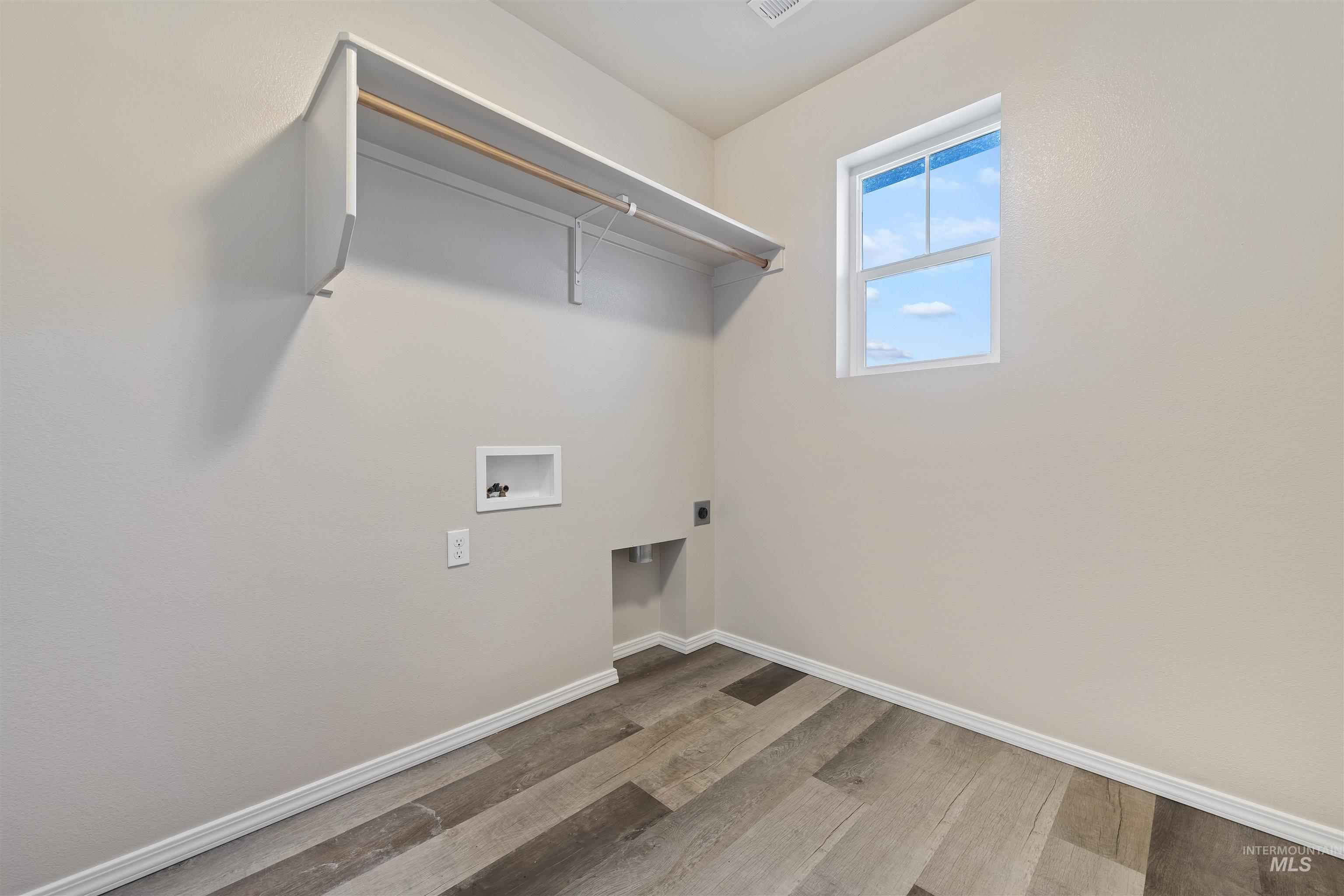 13559 Cocoa Beach Way Caldwell, ID 83607 - Photo 27 of 28 Laundry room featuring light wood-style floors, washer hookup, and hookup for an electric dryer