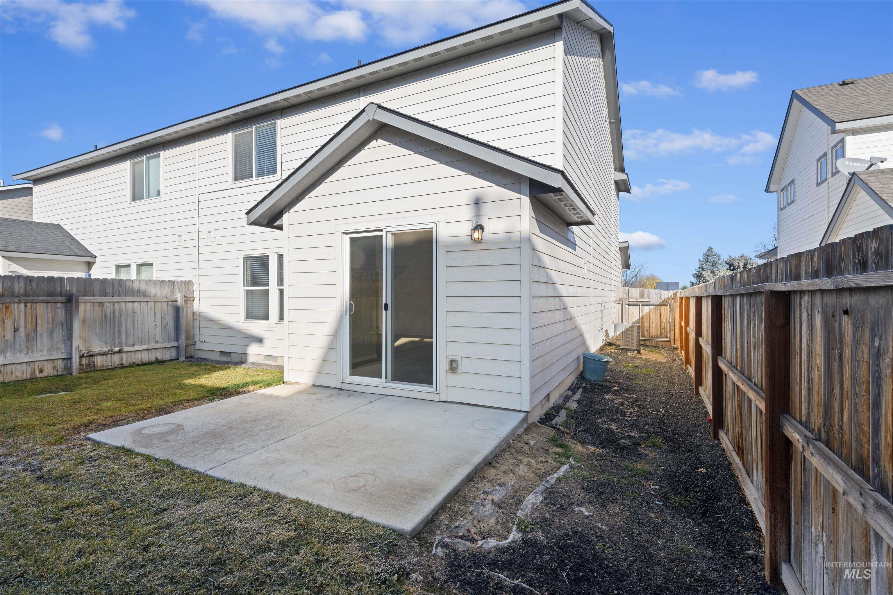 13559 Cocoa Beach Way Caldwell, ID 83607 - Photo 6 of 28 Rear view of property with a patio and a fenced backyard