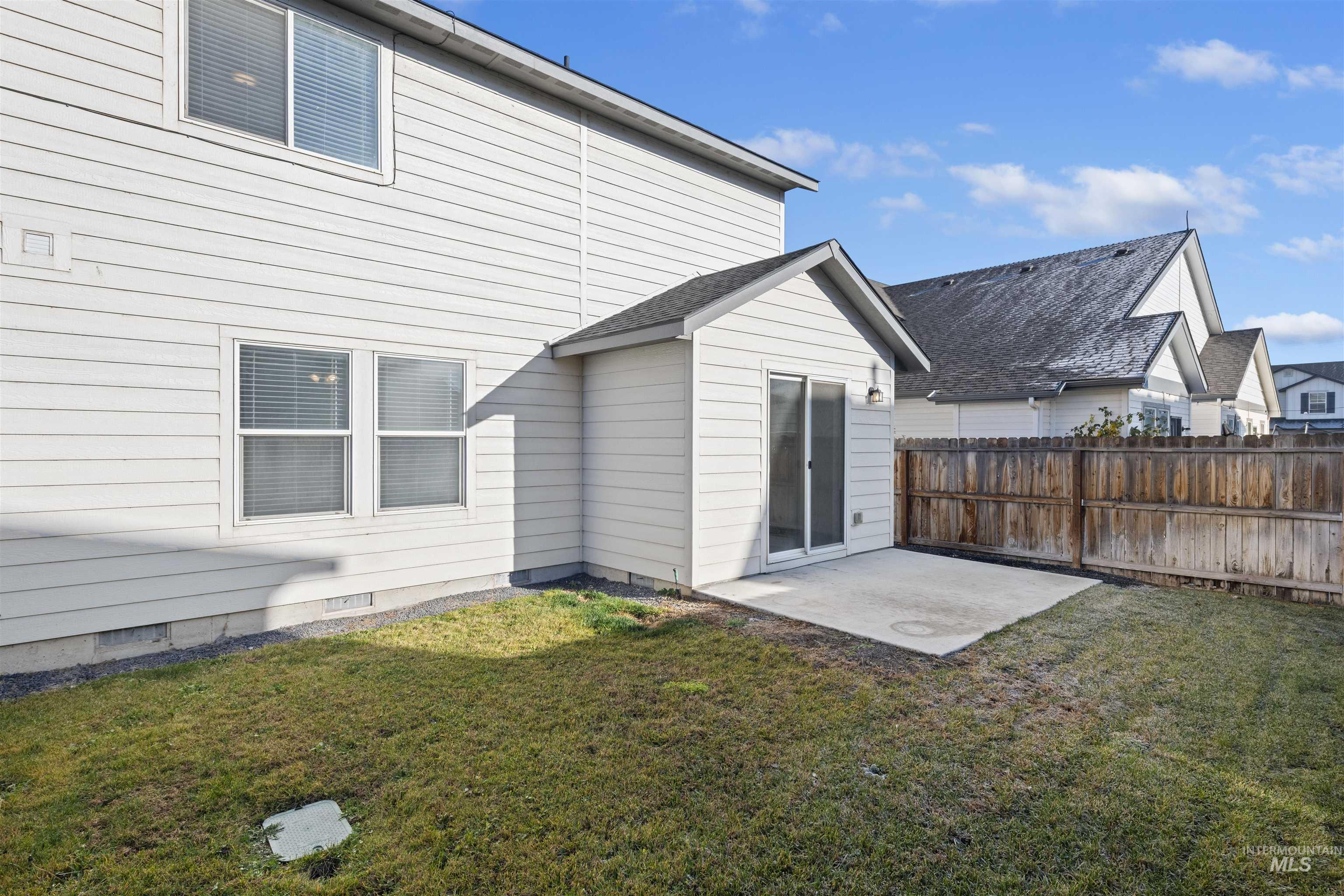 13559 Cocoa Beach Way Caldwell, ID 83607 - Photo 7 of 28 Back of house featuring a patio area and crawl space