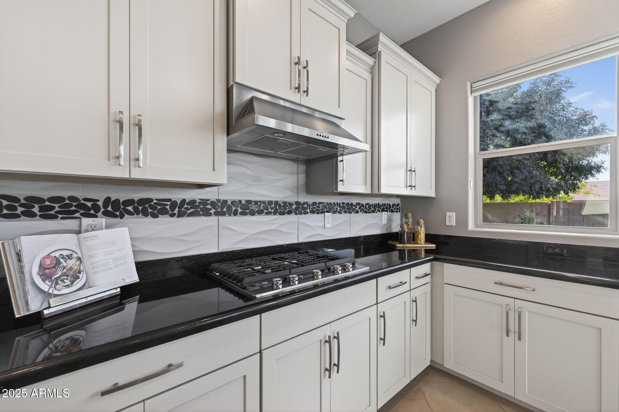 5236 South Excimer Mesa, AZ 85212 - Photo 16 of 85 a kitchen with granite countertop white cabinets and black appliances