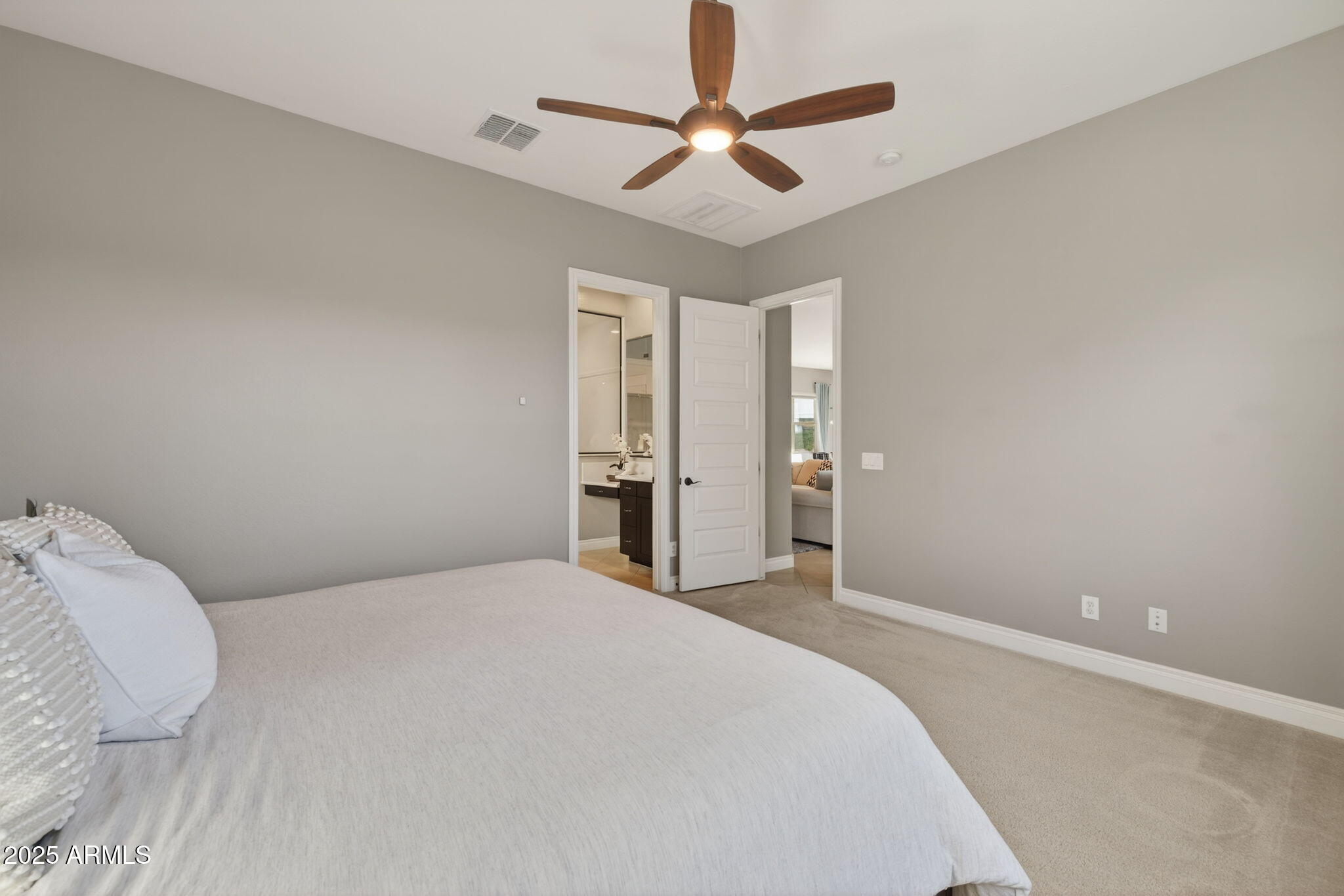 5236 South Excimer Mesa, AZ 85212 - Photo 21 of 85 a bedroom with a large bed and a ceiling fan