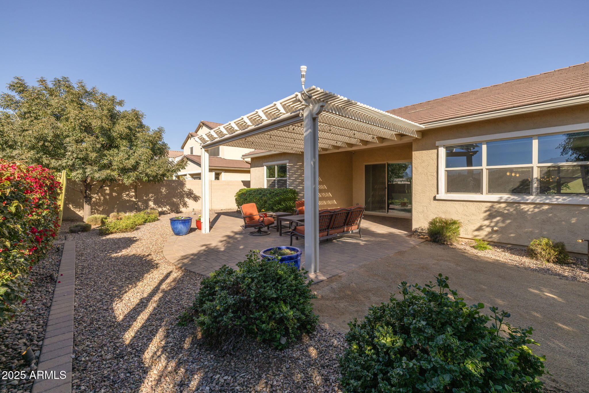 5236 South Excimer Mesa, AZ 85212 - Photo 40 of 85 a view of a house with a small yard and potted plants