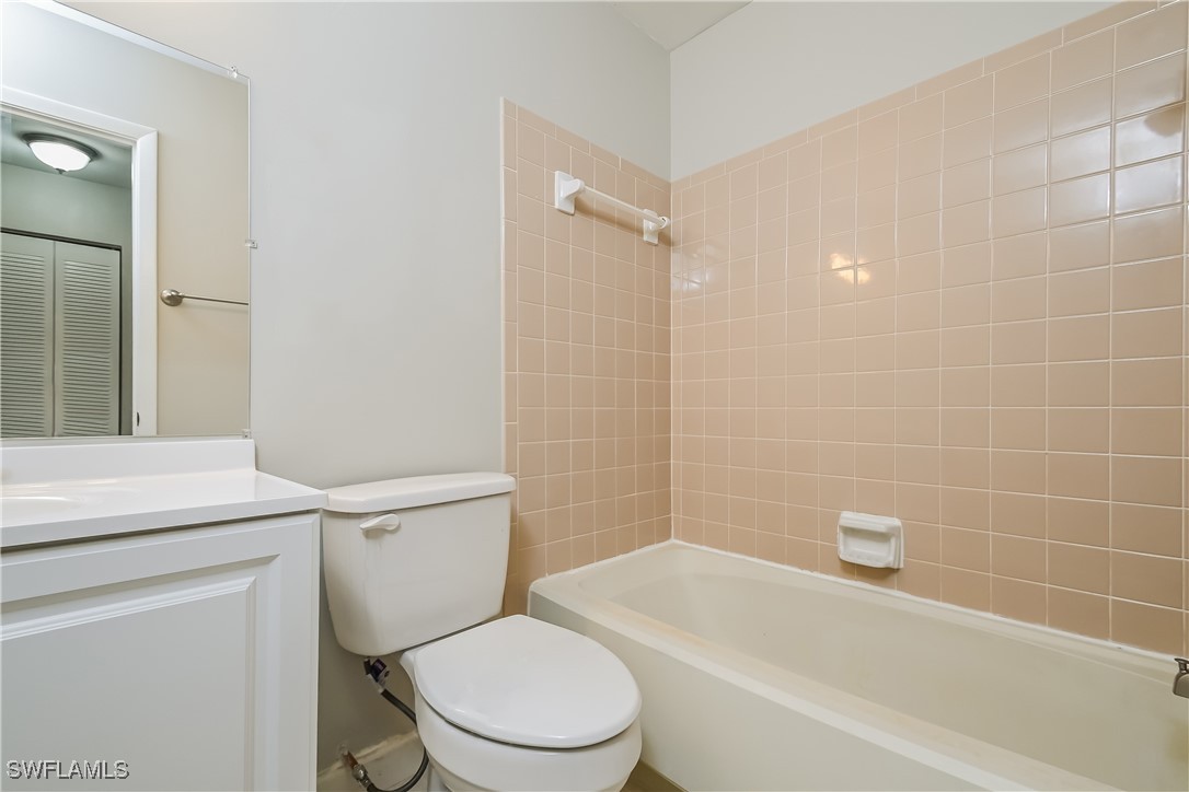 4583 Mongite Road North Port, FL 34287 - Photo 15 of 16 a white toilet and tub sitting next to a bathroom sink