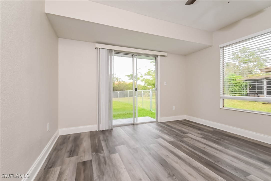 4583 Mongite Road North Port, FL 34287 - Photo 7 of 16 a view of an empty room with wooden floor and a window