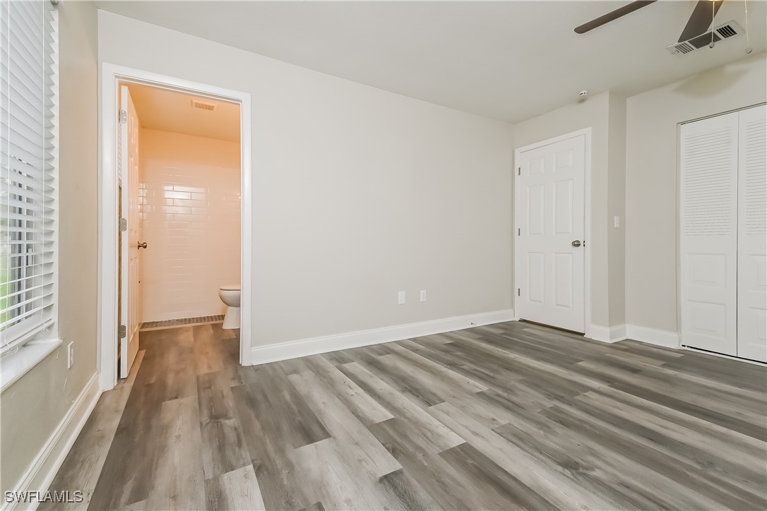 4583 Mongite Road North Port, FL 34287 - Photo 9 of 16 a view of an empty room with wooden floor and a window