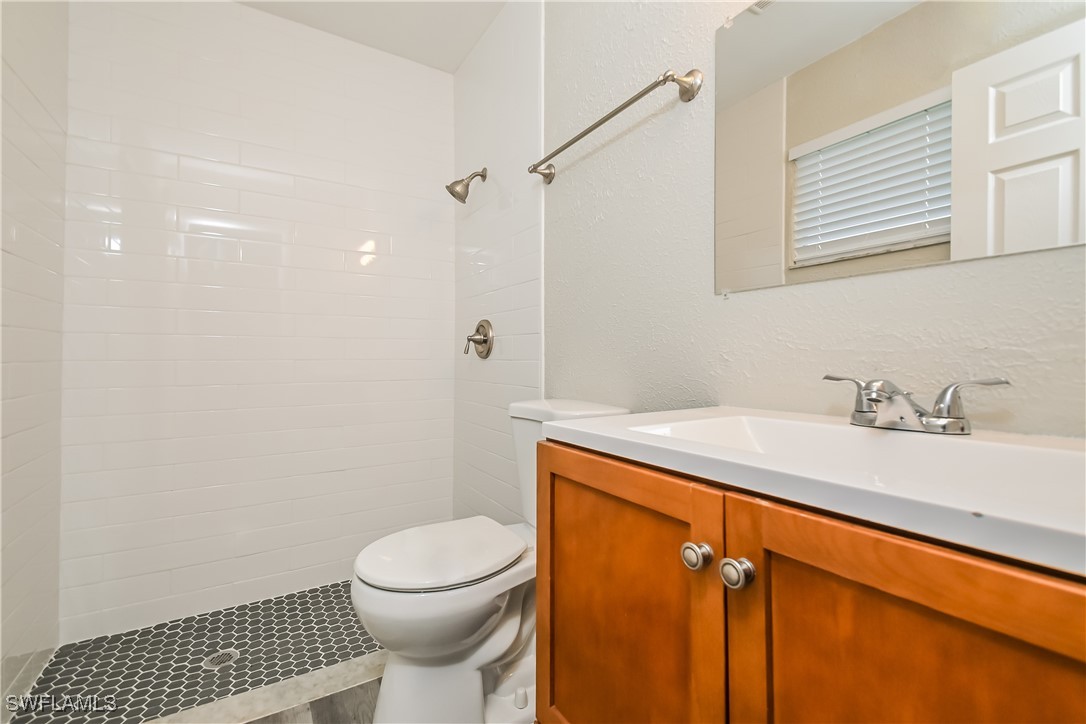 4583 Mongite Road North Port, FL 34287 - Photo 10 of 16 a bathroom with a sink a toilet and shower