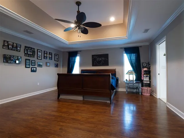 a large kitchen with a sink and a large mirror