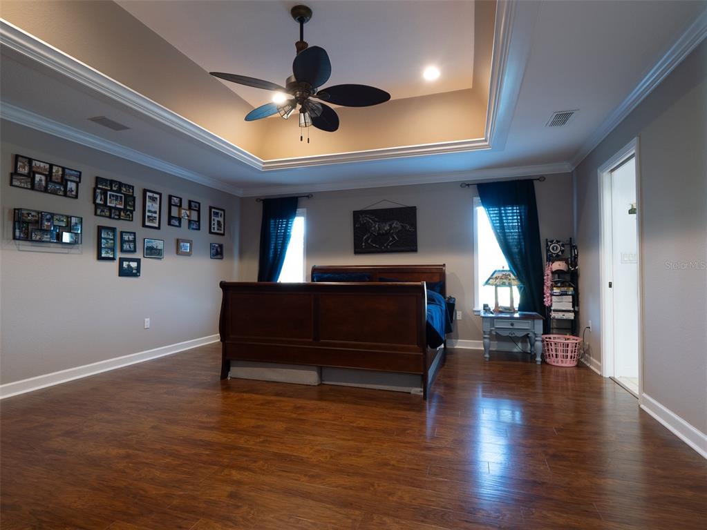5028 West Anthony Road Ocala, FL 34475 - Photo 11 of 31 a living room with furniture and a fireplace