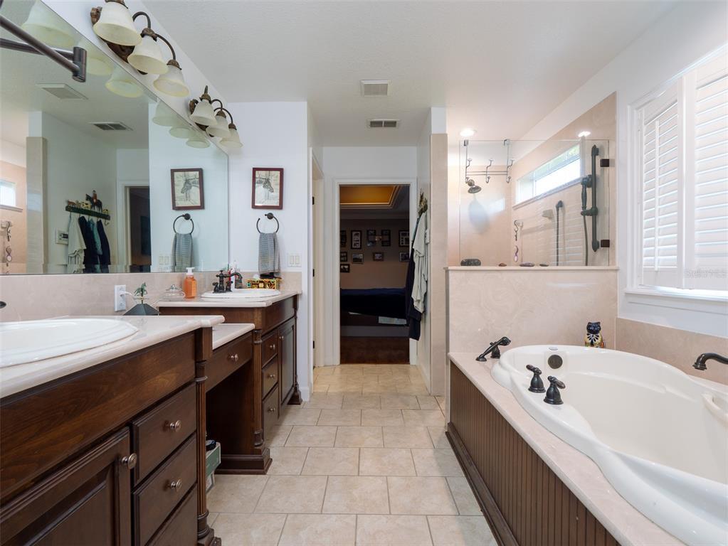 5028 West Anthony Road Ocala, FL 34475 - Photo 12 of 31 a large kitchen with a sink and a large mirror