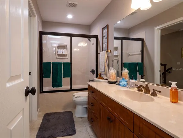 a view of a kitchen with furniture and a ceiling fan