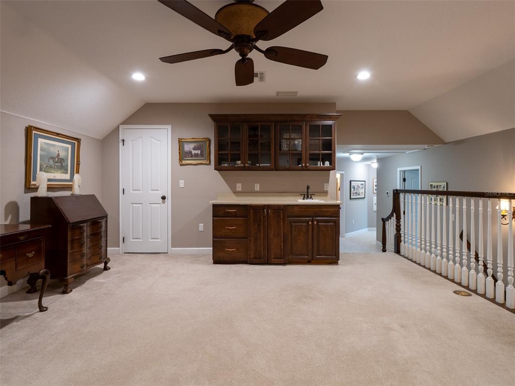 5028 West Anthony Road Ocala, FL 34475 - Photo 17 of 31 a view of a kitchen with furniture and a ceiling fan