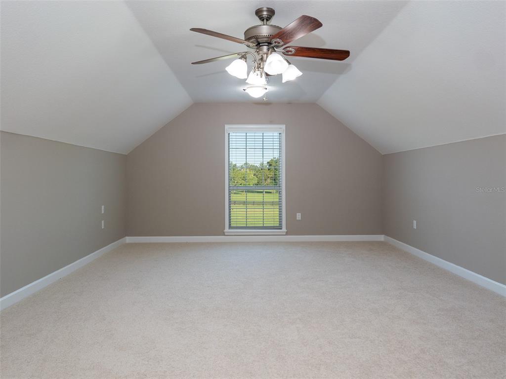 5028 West Anthony Road Ocala, FL 34475 - Photo 18 of 31 a view of an empty room with a window
