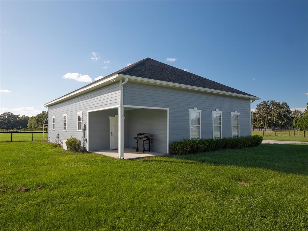 5028 West Anthony Road Ocala, FL 34475 - Photo 22 of 31 a front view of house with yard and green space