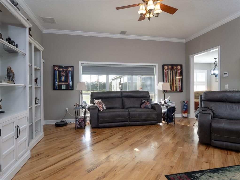 5028 West Anthony Road Ocala, FL 34475 - Photo 5 of 31 a living room with furniture and a large window