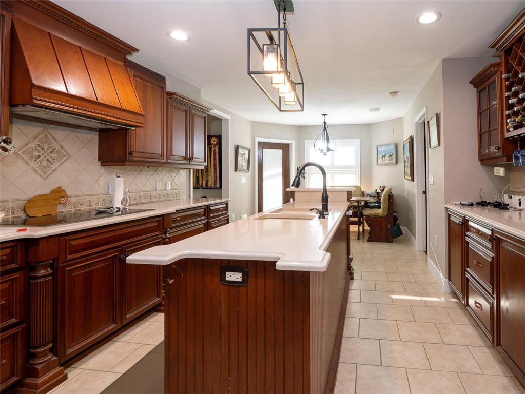 5028 West Anthony Road Ocala, FL 34475 - Photo 9 of 31 a kitchen with stainless steel appliances granite countertop a sink a stove and cabinets