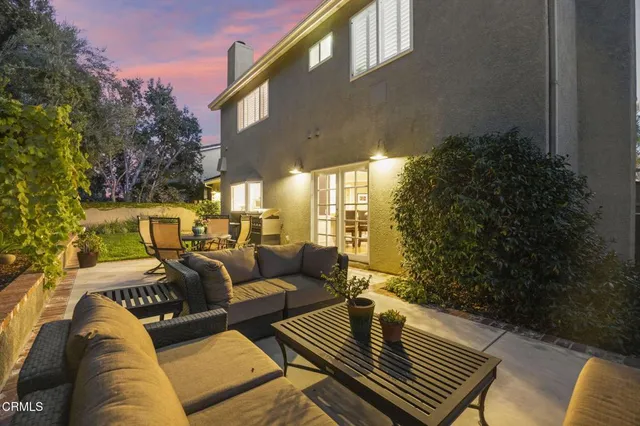 a couple of potted plants in front of door