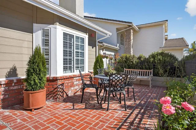 a view of a dining room with furniture and a window