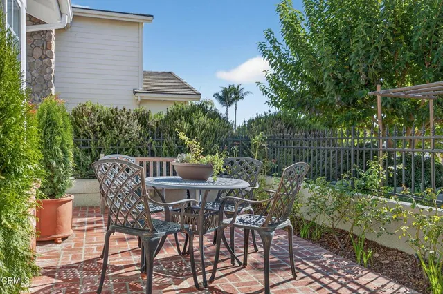 a dining room with furniture a chandelier and wooden floor