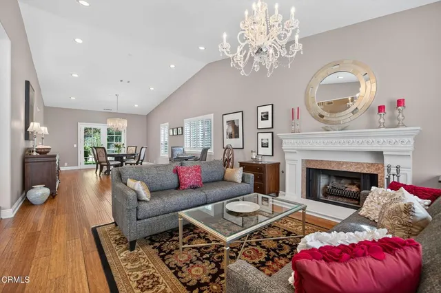 a large kitchen with stainless steel appliances kitchen island granite countertop a sink and cabinets