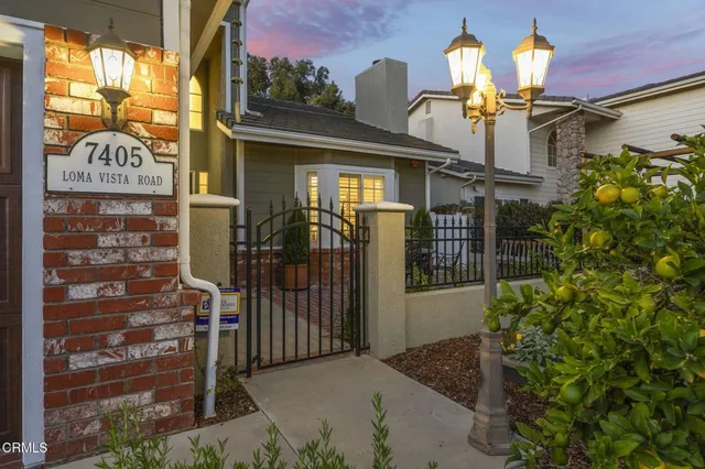 a view of a patio with table and chairs and potted plants