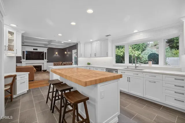 a living room with furniture and a book shelf