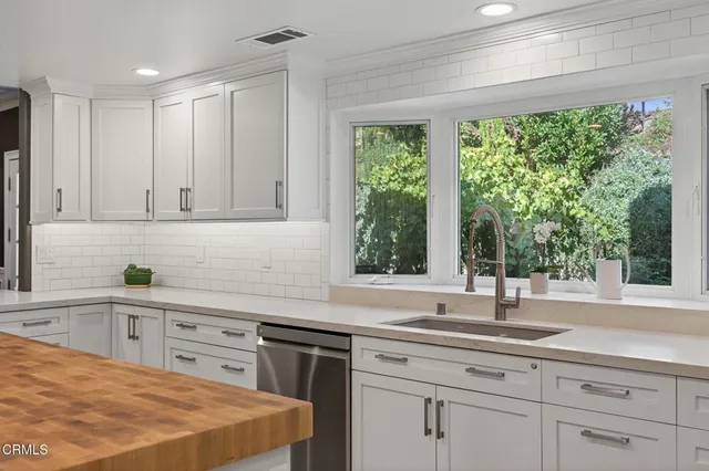 a spacious bedroom with a bed and a fireplace