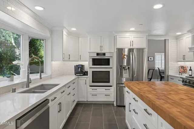 a bedroom with a bed and a fireplace