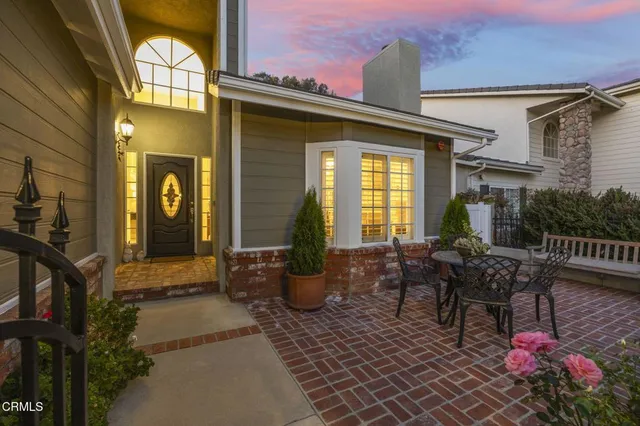 a view of a chairs and table in the patio
