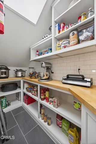 a view of a livingroom with furniture and a window